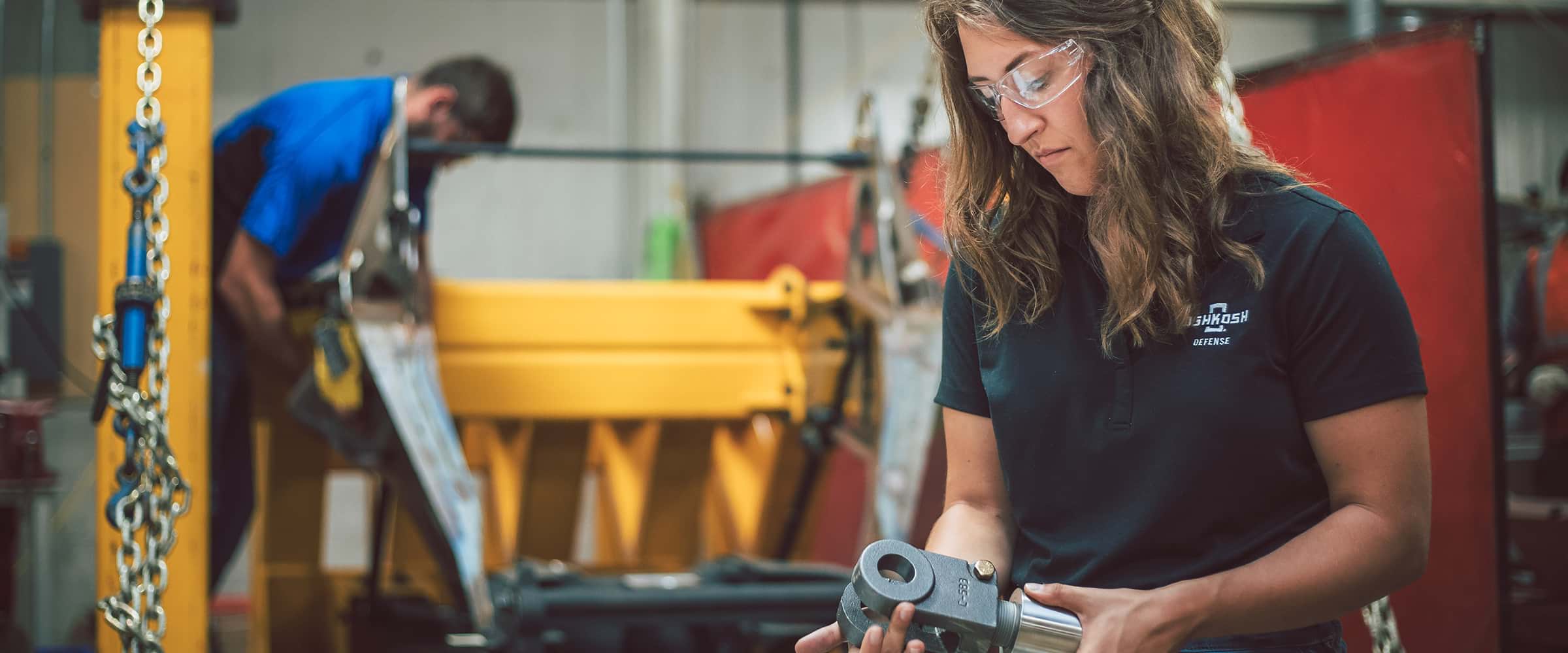 Man and woman working in a production shop