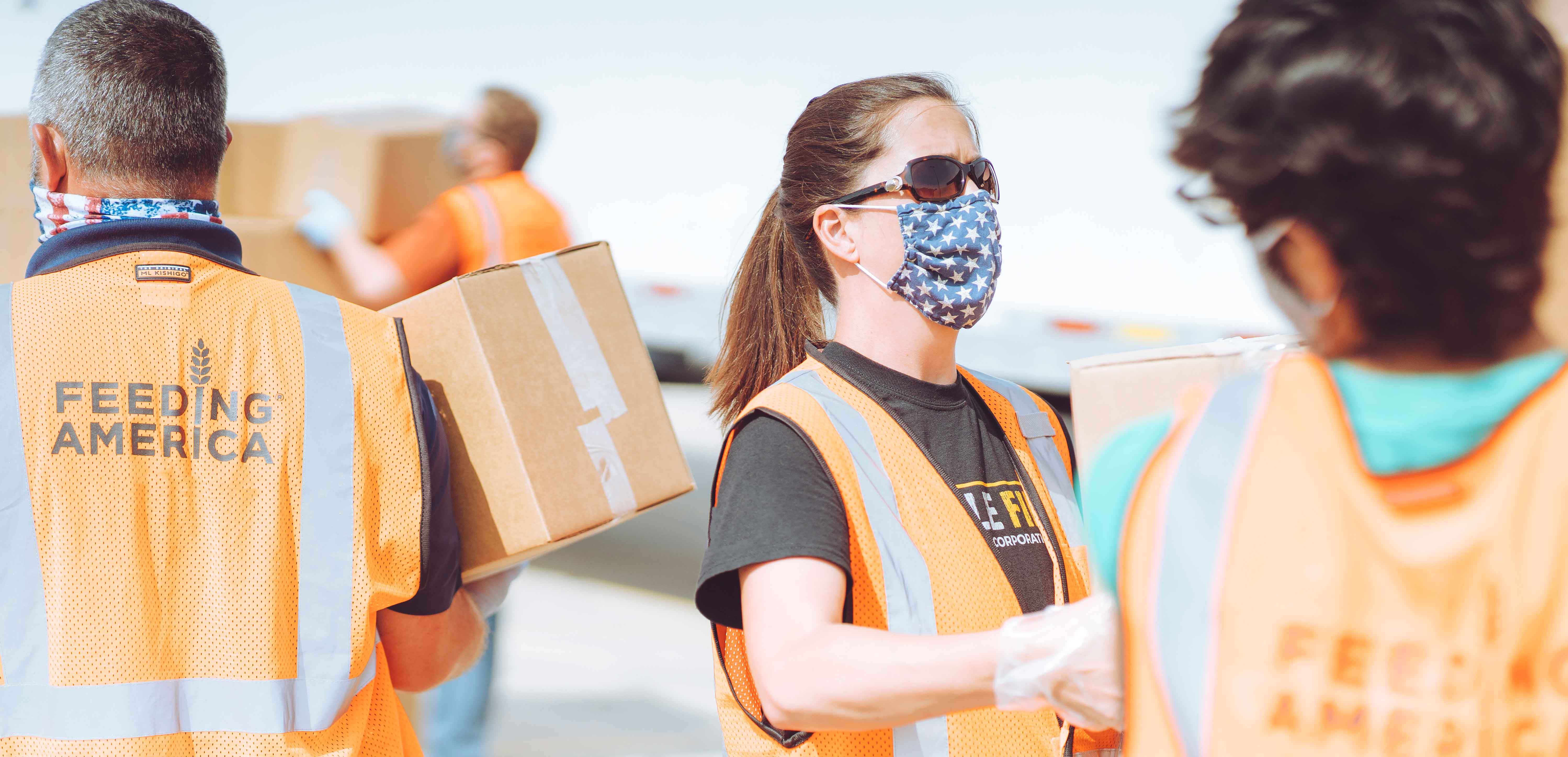 Volunteers helping with the USDA Food Distribution event partnered with Feeding America