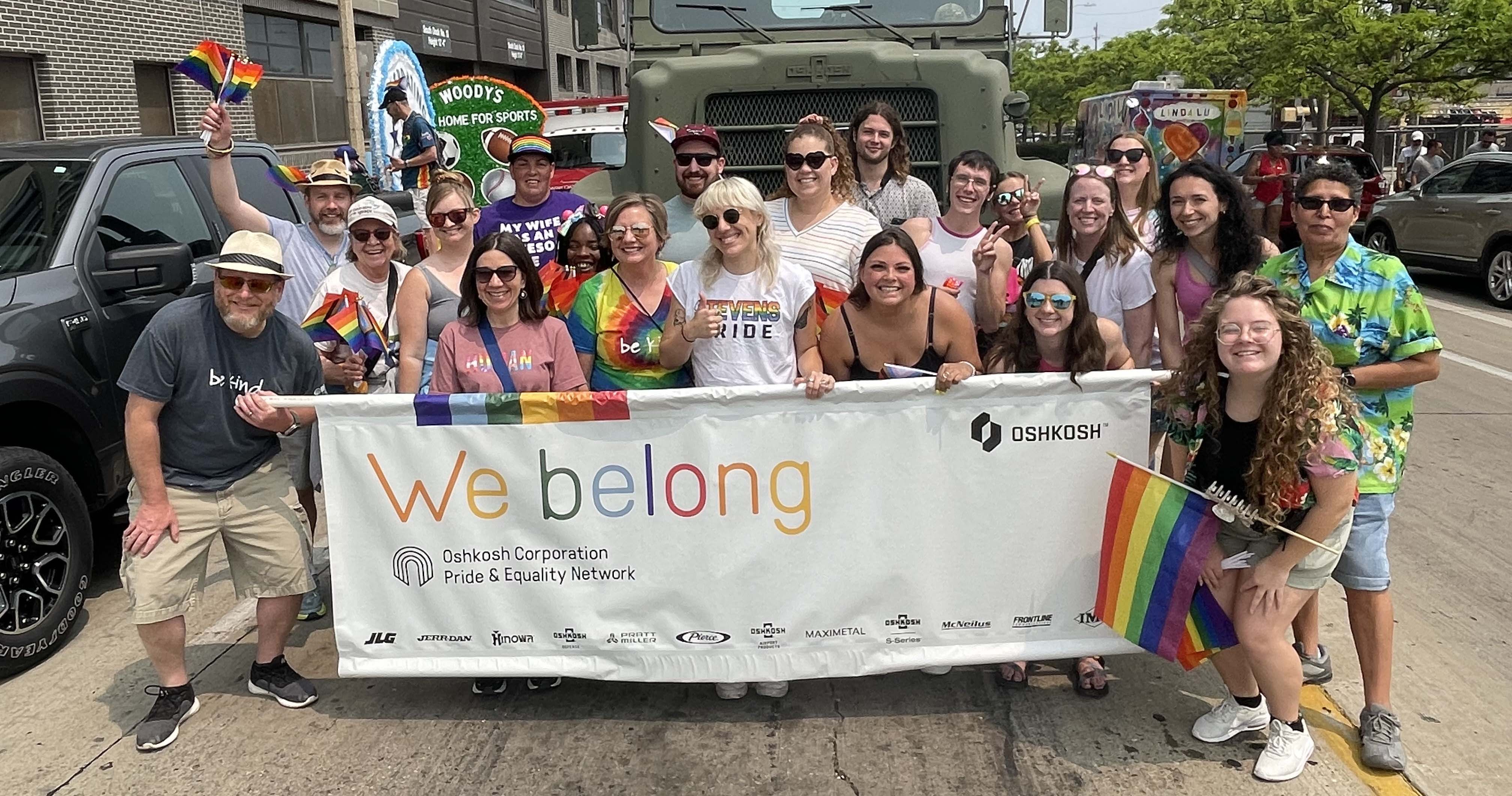  Oshkosh team members participating the Milwaukee Pride Parade outside