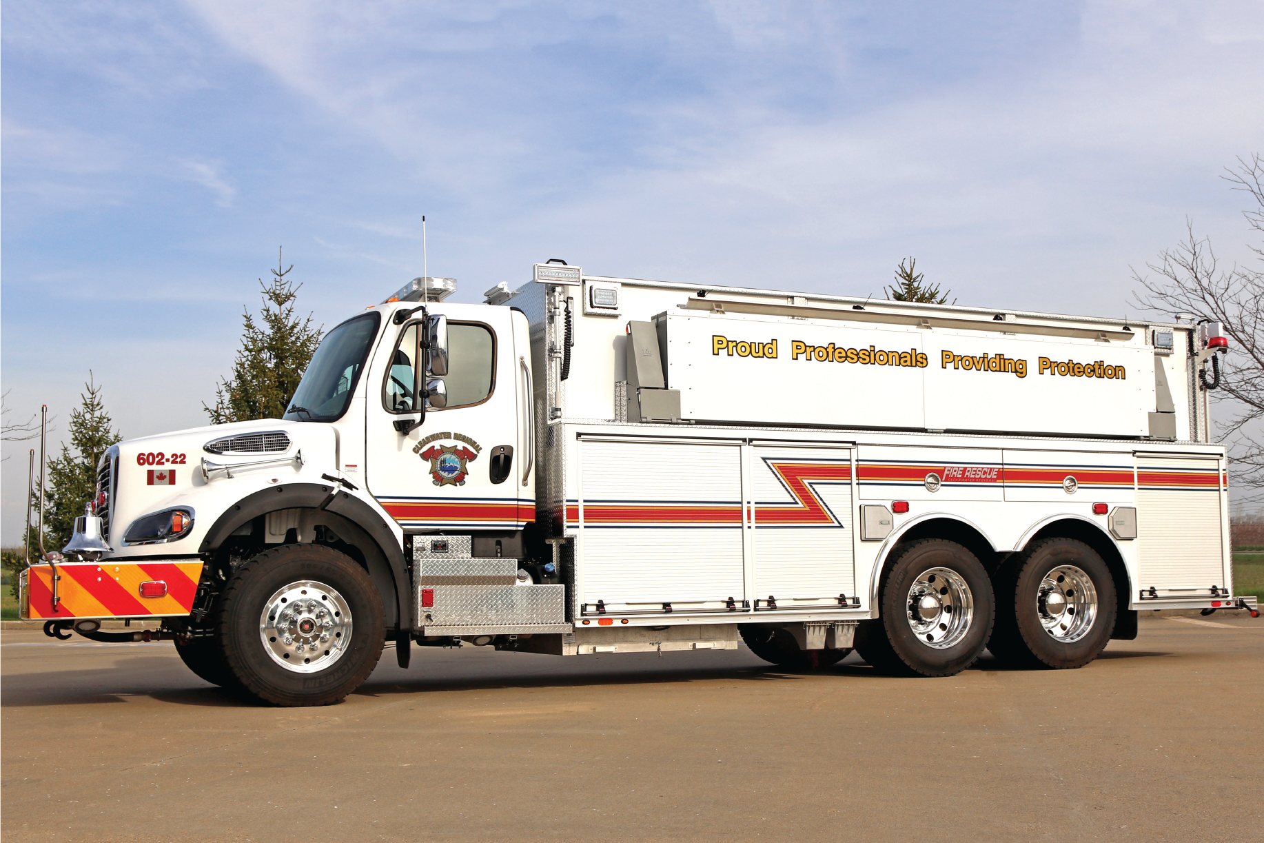 White and red Maxi-Metal truck outside