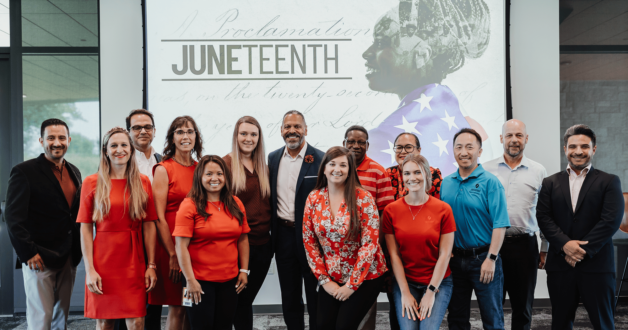  Team members standing with Tyrone Jordon (TJ), Board of Director for Oshkosh Corporation